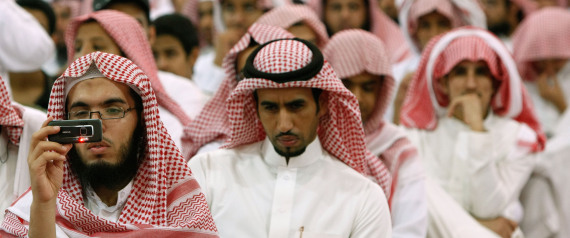 Saudis attend a religious sermon at Rabwat Arriyadh in Riyadh, Saudi Arabia, Sunday, July 12, 2009. Saudi authorities have been poring over psychological profiles of terrorists and studies of how al-Qaida draws in recruits, looking for scientific ways to keep the kingdom's youth away from militancy. One new method they've hit on: segregated Islamic summer camps for the whole family. (AP Photo/Hassan Ammar)